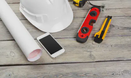 construction worker supplies and instruments on wood